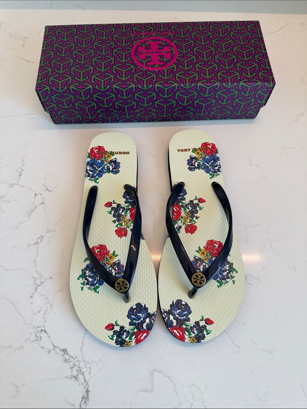 Tory Burch Floral Flip-Flop Sandals in Navy and Cream with Gold Logo